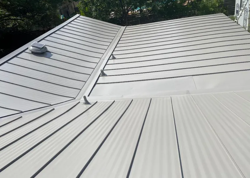 Solar attic fan installed on a metal roof for Roof Ventilation in Lompoc